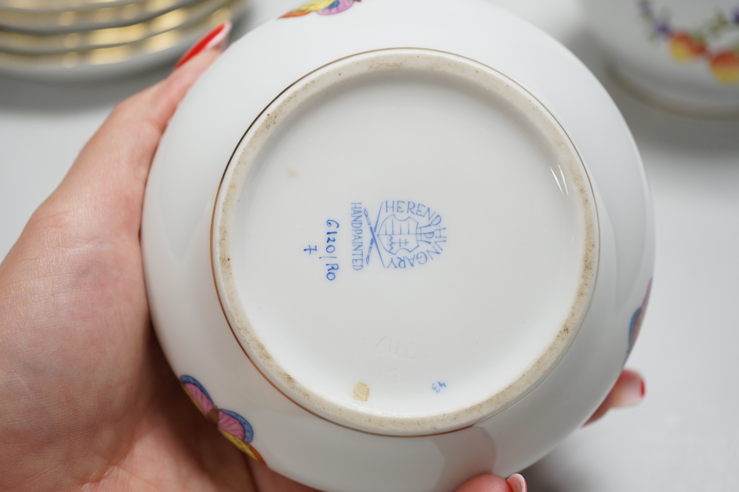 A Herend handpainted pot and cover, a cup and four saucers and teapot decorated with birds and insects and a similar sucrier and cover decorated with fruit